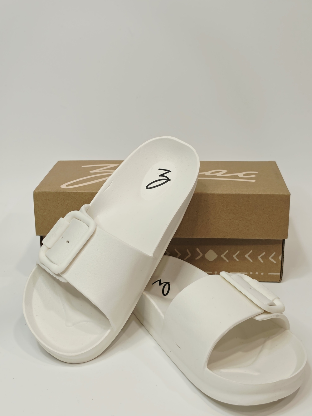 Zodiac Desert White Slide Sandals with Buckle Accent